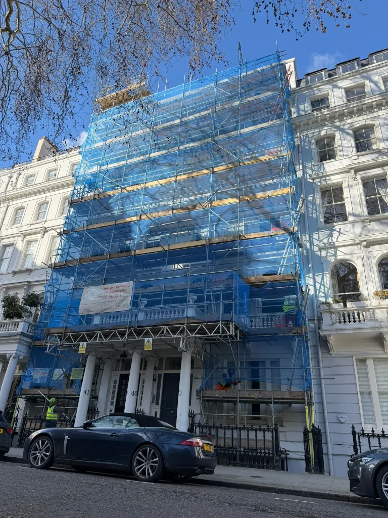 Commercial tube and fitting scaffolding with pedestrian gantry and debris netting installed by A Star London Scaffolding in South Kensington London SW7.