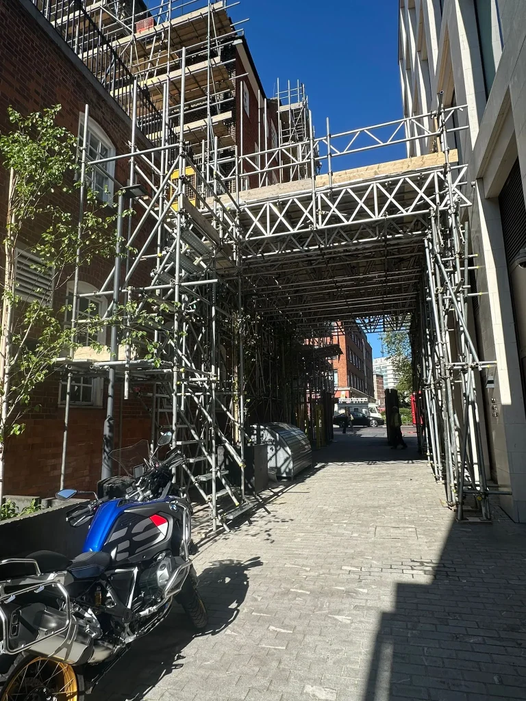 Engineered pedestrian gantry and commercial tube and fitting scaffolding installed by A Star London Scaffolding at Waterloo Road, London SE1.
